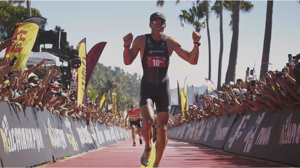 A man completing his Ironman race